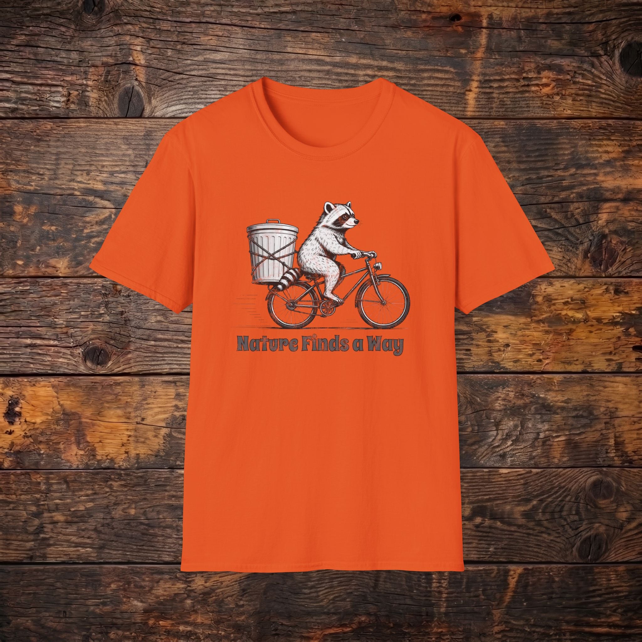 Raccoon on Bike T-Shirt — 'Nature Finds a Way' Graphic Tee